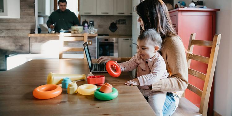 Woman with young child in kitchen - Ofgem