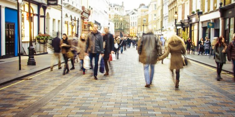 Shopping precinct with people moving around - Ofgem 