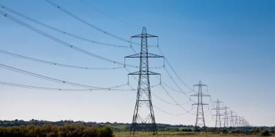 Pylons in countryside and sunshine - Ofgem