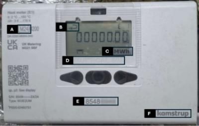 Good example photo of an unpackaged unit (integrator) annotated with the MID Compliance, arrow indicating the pipe mounting position, reading in MWH or kWh, Model, Serial number (8 digits) and Model brand name 